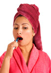 Woman Brushing Her Teeth With A Tooth Brush